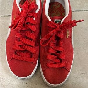 Puma red suede sneakers gently worn